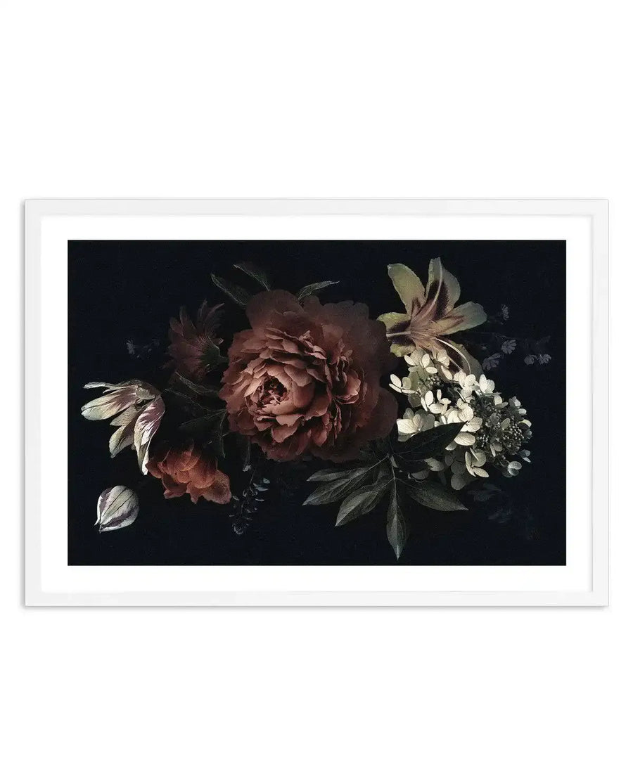 Framed art print featuring a dark botanical illustration against a black background. The composition displays a central dusty rose peony with layered petals, flanked by cream and white flowering stems on the right, and delicate pale pink flowers on the left. Dark green foliage and small blue-grey accents are scattered throughout. The illustration uses a classical oil painting style with soft, detailed rendering. The artwork is presented in a white frame with white border.