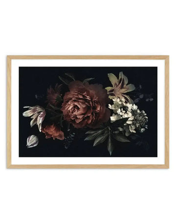 Art print featuring a dramatic botanical illustration of dark, moody flowers on a black background, displayed in a natural oak frame with white border. The composition includes a large central peony in deep burgundy and rust tones, surrounded by smaller blooms in similar hues, pale cream and green hydrangeas, and slender green leaves.