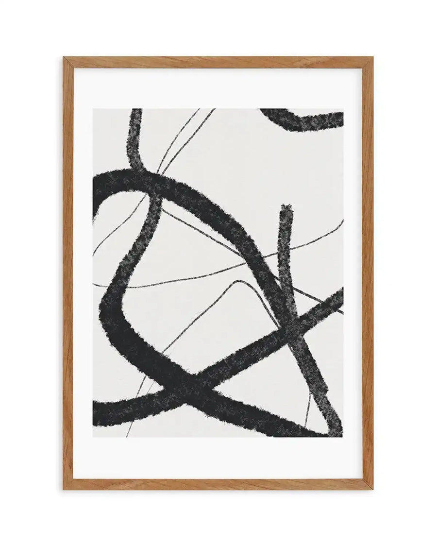 Abstract art print featuring bold, expressive black brushstrokes on a white background, creating a dynamic and energetic composition. The strokes vary in thickness and direction, with some appearing thick and textured, while others are thinner and more fluid, displayed in a natural oak frame with white border.