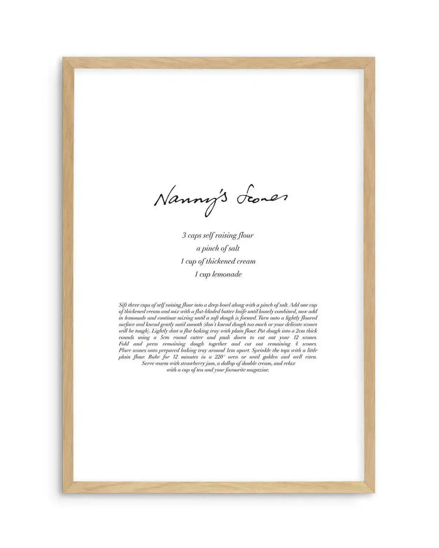 Art print featuring a handwritten recipe for "Nanny's Scones" in black script on a white background, printed on fine art paper and displayed in a natural oak frame with white border. The recipe lists ingredients and instructions for making scones.