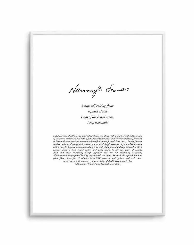 Art print featuring a handwritten recipe for "Nanny's Scones" in black script on a white background, displayed in a simple white frame. The recipe lists ingredients: "3 cups self raising flour, a pinch of salt, 1 cup of thickened cream, 1 cup lemonade," followed by detailed instructions for making and serving the scones.