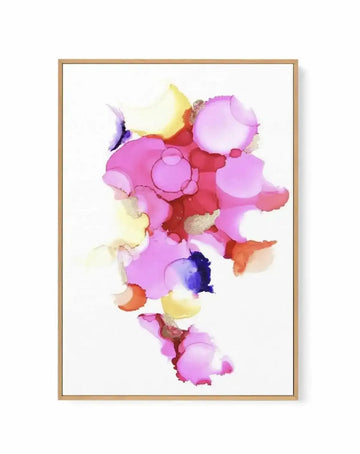 Framed canvas art print featuring an abstract composition of overlapping organic shapes in vibrant colors including hot pink, magenta, pale yellow, coral orange, and deep blue, with watercolor-style blending and translucent layers creating depth. The artwork is mounted in a natural wood frame with a white border, displayed against a white background.
