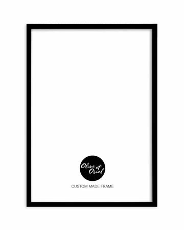 Black wooden frame containing white background with centered black circle logo and white handwritten script text reading "Olive et Oriel" above gray text reading "CUSTOM MADE FRAME" positioned in lower center area, displayed against plain white background.