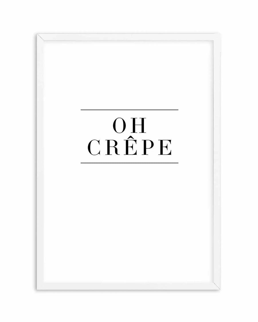 White framed art print featuring the text "OH CRÊPE" in black serif font, centered on a white background with horizontal lines above and below the text. The print is displayed in a white wooden frame with visible depth and dimension.