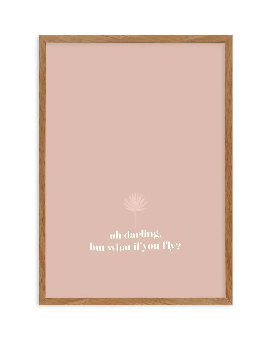 Framed art print with a soft dusty rose background featuring white text reading "oh darling, but what if you fly?" positioned in the lower portion. A delicate line-drawn dandelion illustration appears above the text in a lighter rose tone. The print is set in a natural wood frame with a white border.