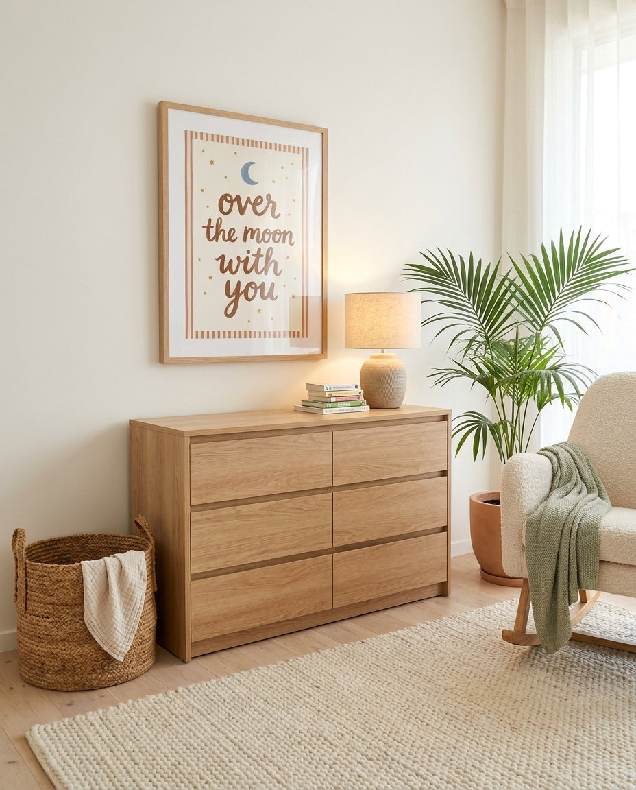 Over The Moon With You nursery art print framed and styled on the wall of a coastal Australian baby room at Olive et Oriel