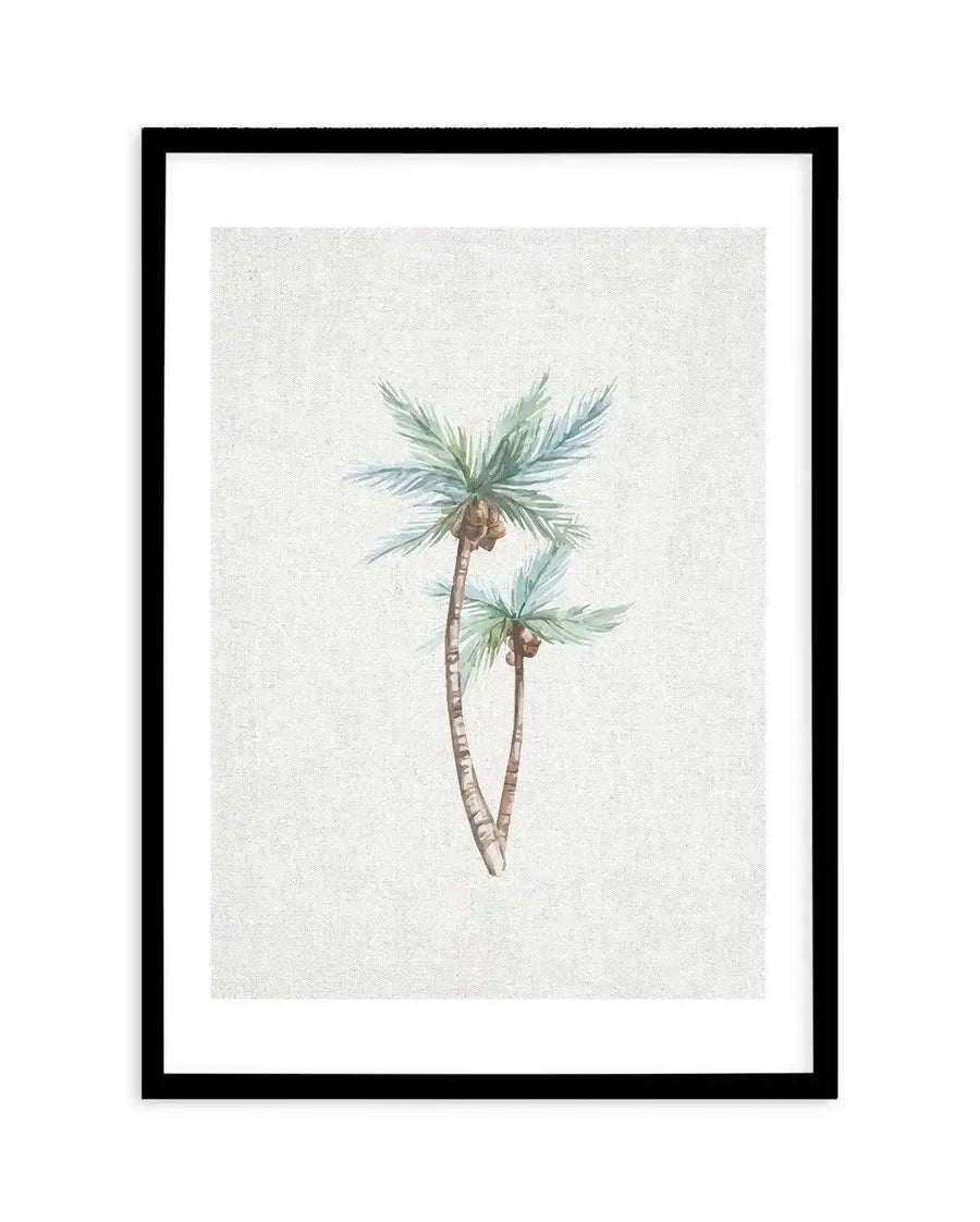 Watercolour art print featuring two palm trees with light blue-green fronds and brown coconuts, on a textured off-white background, displayed in a black frame with white border.