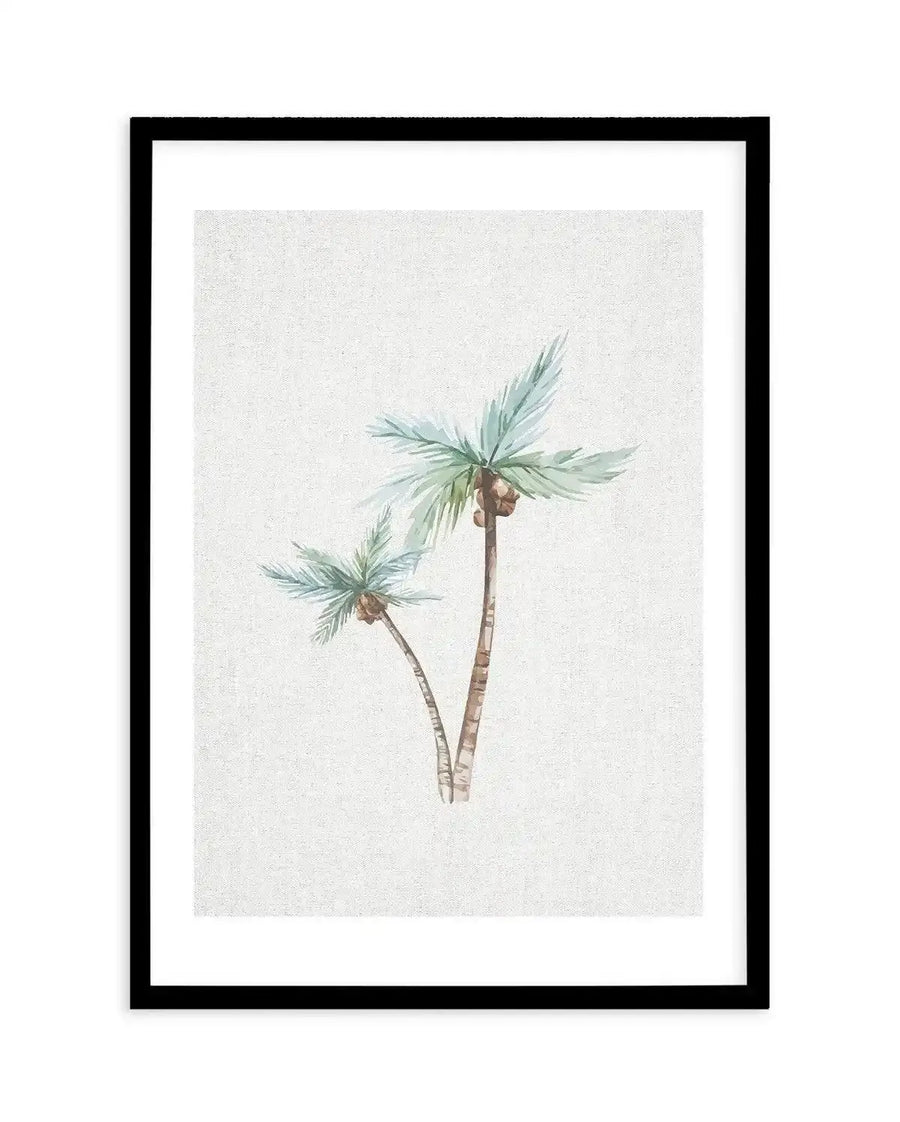 Watercolour art print featuring two palm trees with light blue-green fronds and brown coconuts, against a textured off-white background, printed on fine art paper and displayed in a black frame with white border.