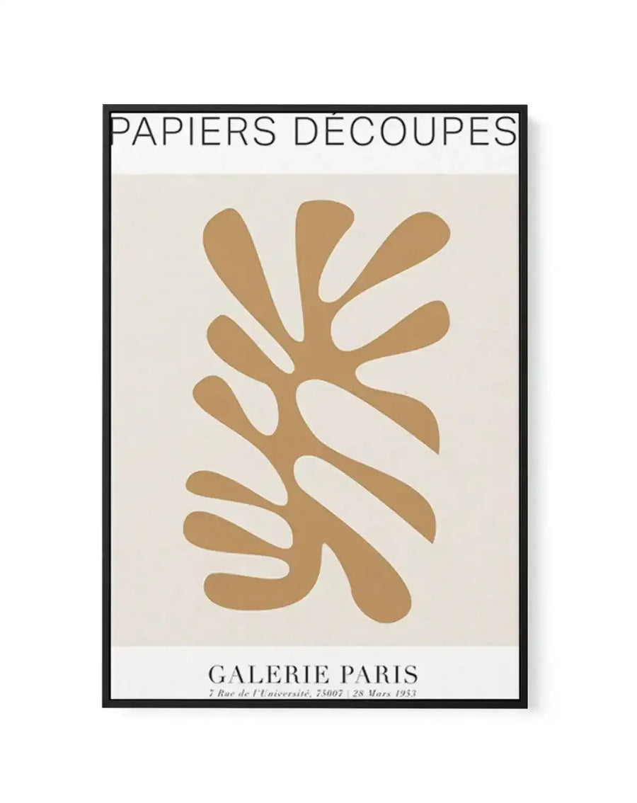 Framed canvas art print titled "Papiers Decoupes" featuring an abstract botanical illustration in warm tan and caramel tones against a cream background. The design shows organic, leaf-like shapes with curved cutouts arranged in a vertical composition, evoking mid-century modern aesthetic. Black frame with white border. Exhibition details for Galerie Paris dated 28 Mars 1953 printed at bottom.