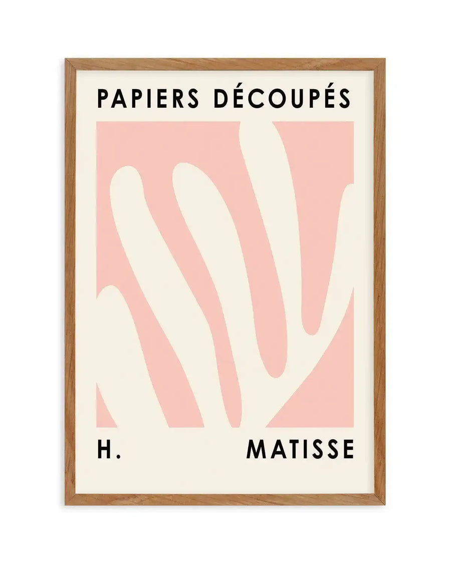 Art print featuring abstract, organic shapes in a soft blush pink against a creamy off-white background, with the text "PAPIERS DÉCOUPÉS" at the top and "H. MATISSE" at the bottom in black sans-serif font, displayed in a natural oak frame with a white border.