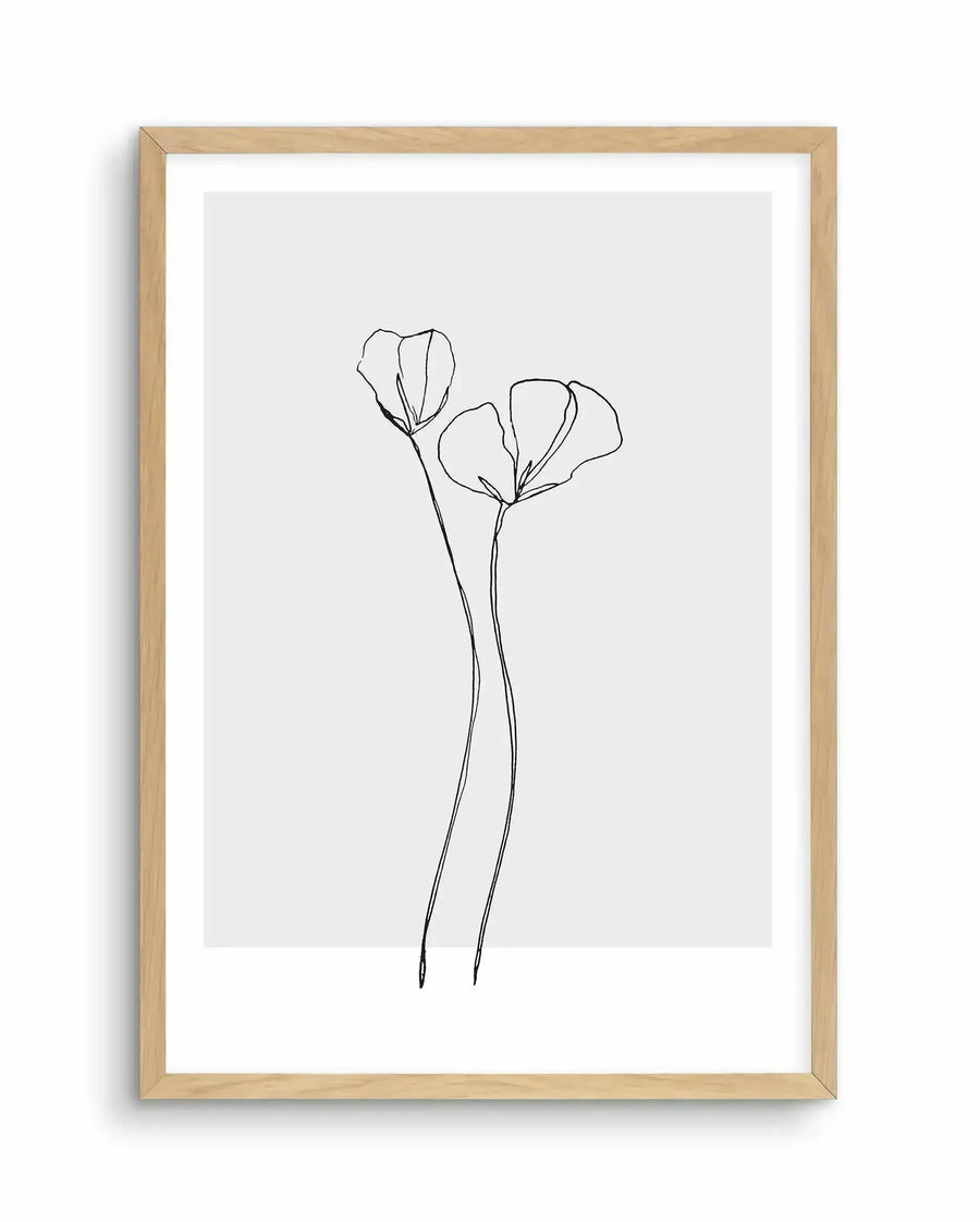Minimalist line drawing of two poppy flowers with delicate, curved petals on long, gracefully arching stems. The artwork is rendered in black ink on a light gray background, framed in natural wood with a white border. The illustration style is simple and elegant, capturing the botanical form through continuous, flowing lines.
