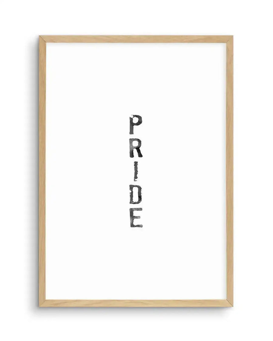 Watercolour art print featuring the word "PRIDE" stacked vertically in black, distressed, block letters on a white background, displayed in a natural oak frame with white border.