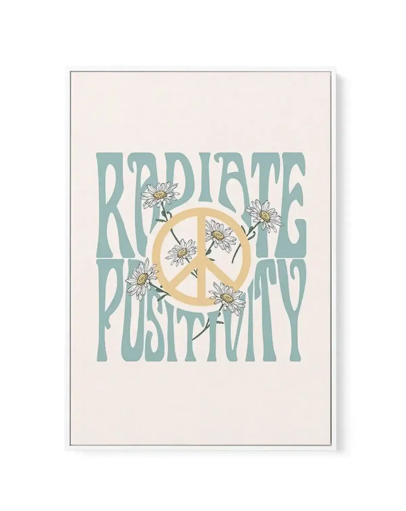 Framed canvas art print with cream background featuring teal-colored block lettering reading "RADIATE POSITIVITY" arranged in two lines. A tan peace symbol with white daisies illustrated inside and around it occupies the center. Gray frame with white border visible around the edges.