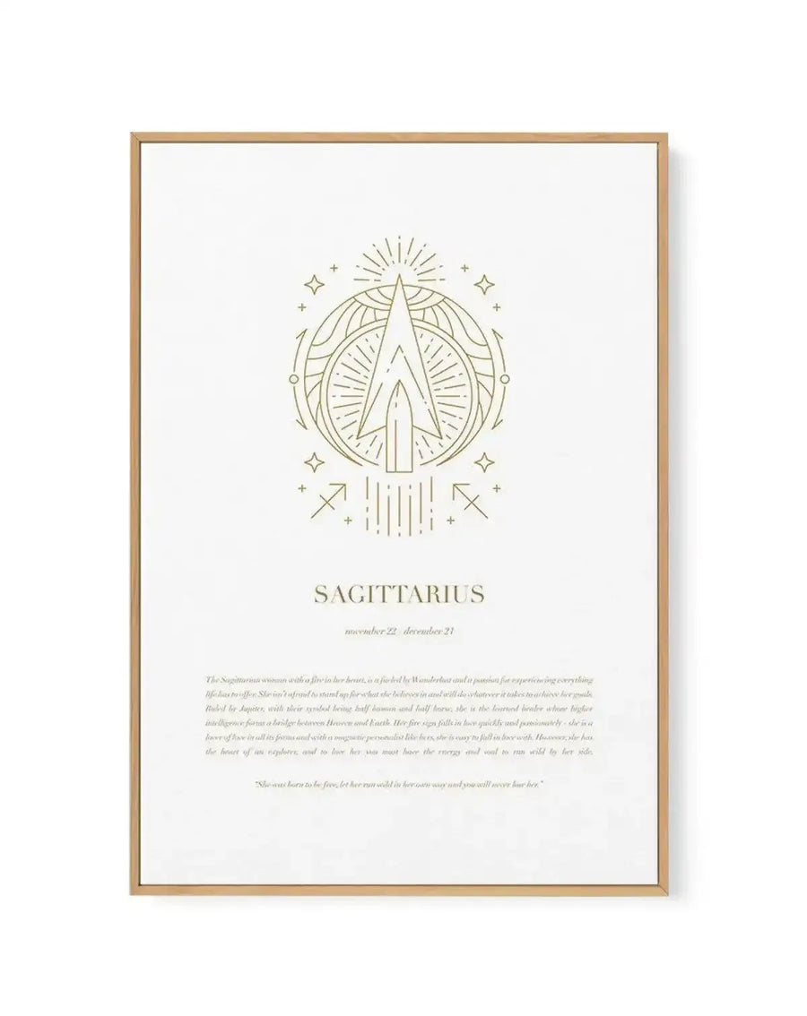 Sagittarius zodiac framed canvas art print featuring a gold line illustration of an archer's arrow within a circular mandala design, surrounded by radiative lines and small stars. The text "SAGITTARIUS" appears below the symbol with "november 22 - december 21" in smaller font. Descriptive paragraph text about Sagittarius traits is printed in gold below, followed by an italicized quote. The artwork is rendered in muted gold tones on an off-white background, enclosed in a natural wood frame with white border.