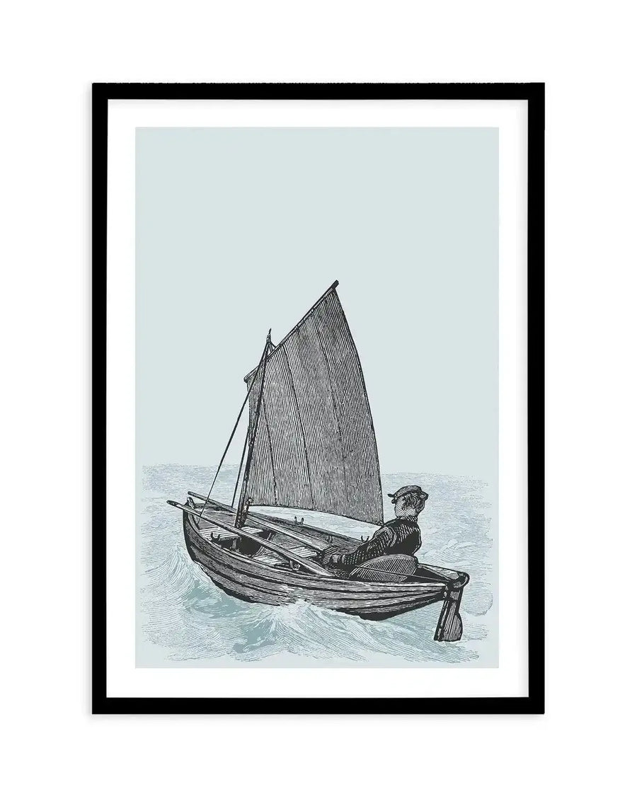 Art print featuring a black and white illustration of a man sailing in a small boat on a light blue sea, printed on fine art paper and displayed in a black frame with a white border. The man is seated at the stern, steering with a rudder, and the boat has a single sail. The sea is depicted with gentle waves.