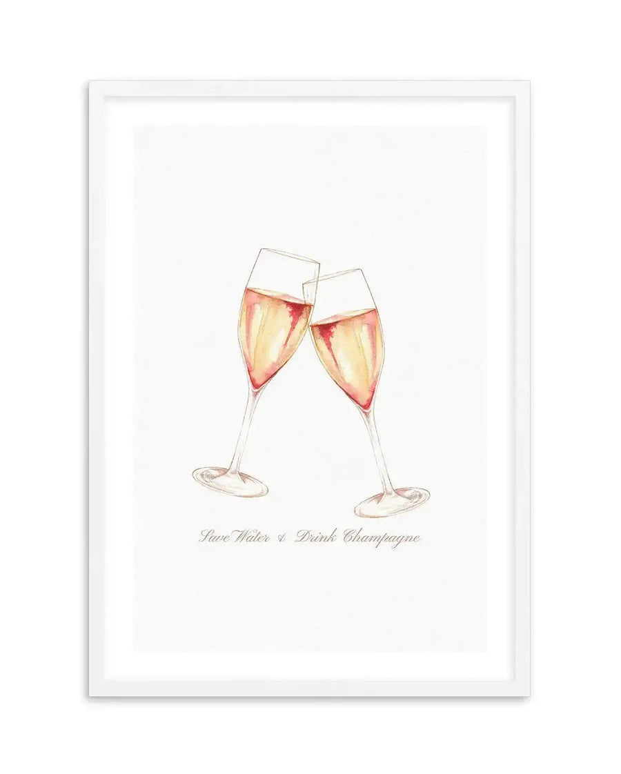 Framed art print featuring a watercolor illustration of two champagne flutes clinking together, filled with pale golden and rose-tinted champagne. The glasses are rendered in soft, translucent washes of peach, coral, and cream against a white background. Below the illustration, cursive text reads "Save Water & Drink Champagne." The artwork is mounted in a white frame with a white border.