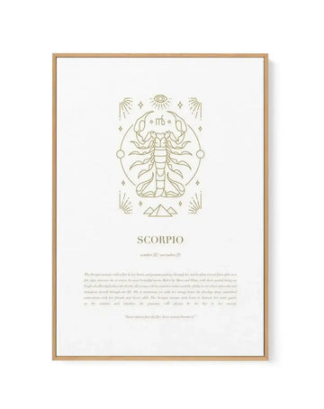 Framed canvas print featuring a minimalist line art illustration of a scorpion in gold on a white background, with a natural wood frame and white border. The scorpion is centered within a circular outline, surrounded by celestial elements like stars, an eye, and radiating lines. Below the illustration, the word "SCORPIO" is printed in gold, followed by "october 22 - november 21" and a detailed description of the Scorpio woman in a smaller gold font.