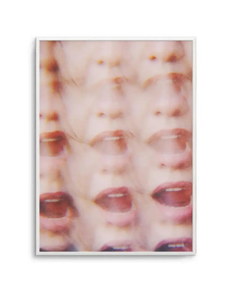 Abstract art print featuring a blurred, repeating pattern of a person's face with open mouth and visible teeth, creating a sense of motion and distress. The muted colour palette consists of pale pinks, creams, and soft reds, with a slightly grainy, photographic texture, displayed in a white frame with a white border.