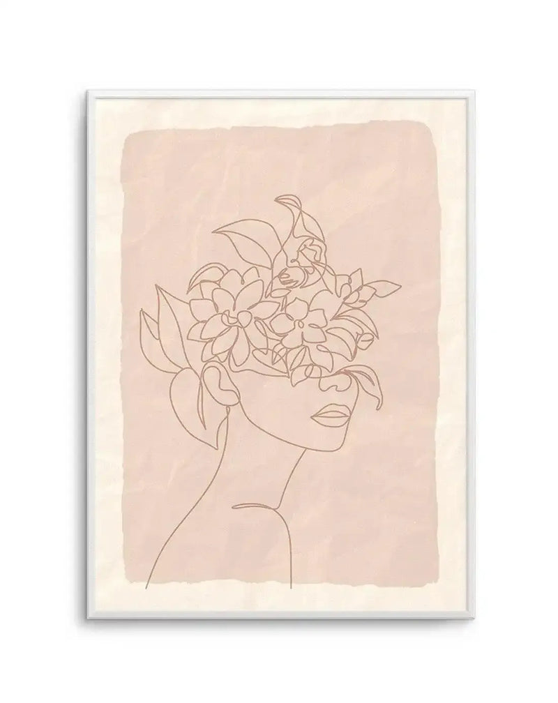 Line art print featuring a woman's profile with her face obscured by a bouquet of flowers and leaves, drawn in a single continuous line in a warm brown tone on a textured blush pink background with a cream border, displayed in a white frame.