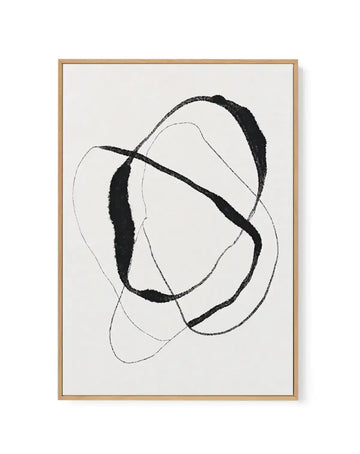 Framed canvas art print featuring abstract organic shapes in black ink on cream background. Two overlapping rounded forms with bold black filled sections and delicate gray outlined curves create a minimalist, flowing composition. Natural wood frame with white border. Vertical rectangular orientation.