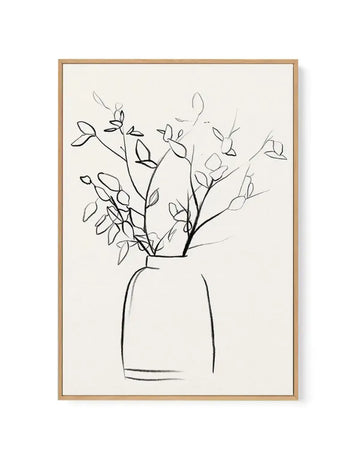 Framed canvas art print featuring a minimalist line drawing of branching stems with small leaves in a simple vase against a cream background. The sketch uses black ink with loose, gestural linework. The artwork is set in a natural wood frame with a white border, displayed as a vertical composition.