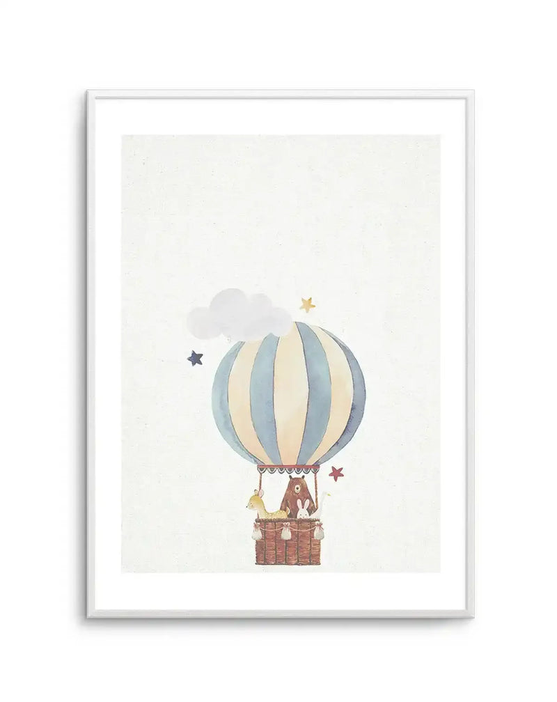 Watercolour art print featuring a hot air balloon in pale blue and cream stripes, carrying a deer, a bear, and two rabbits in a woven basket. The scene includes a fluffy white cloud and scattered stars in blue, yellow, and red, all set against a textured off-white background, displayed in a white frame with a white border.