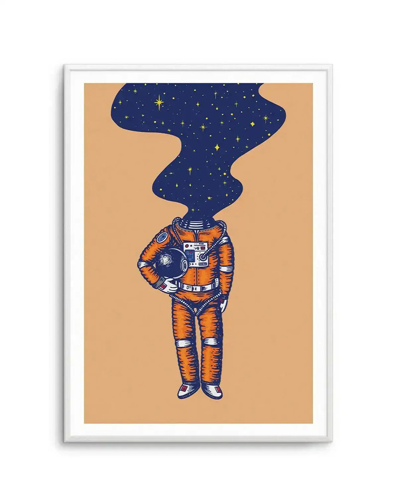 "Illustration art print featuring an astronaut in an orange spacesuit with a dark blue, star-filled nebula for a head, holding a helmet under one arm, displayed in a white frame with white border. The astronaut stands centrally against a warm beige background, with visible cross-hatch shading on the suit."