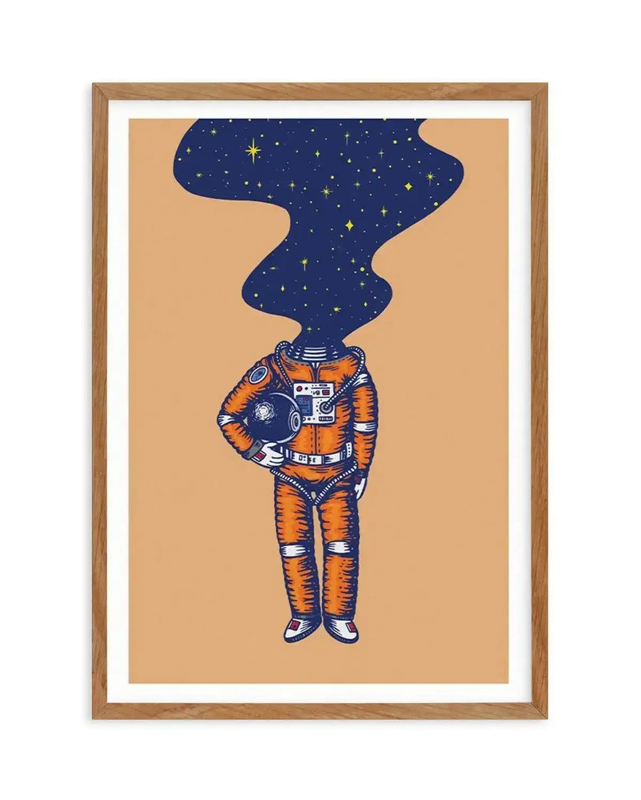 Art print featuring an illustration of an astronaut in an orange and blue spacesuit with a dark blue, star-filled nebula emerging from the neck opening, holding a helmet in one hand, on a warm beige background, displayed in a natural oak frame with white border.