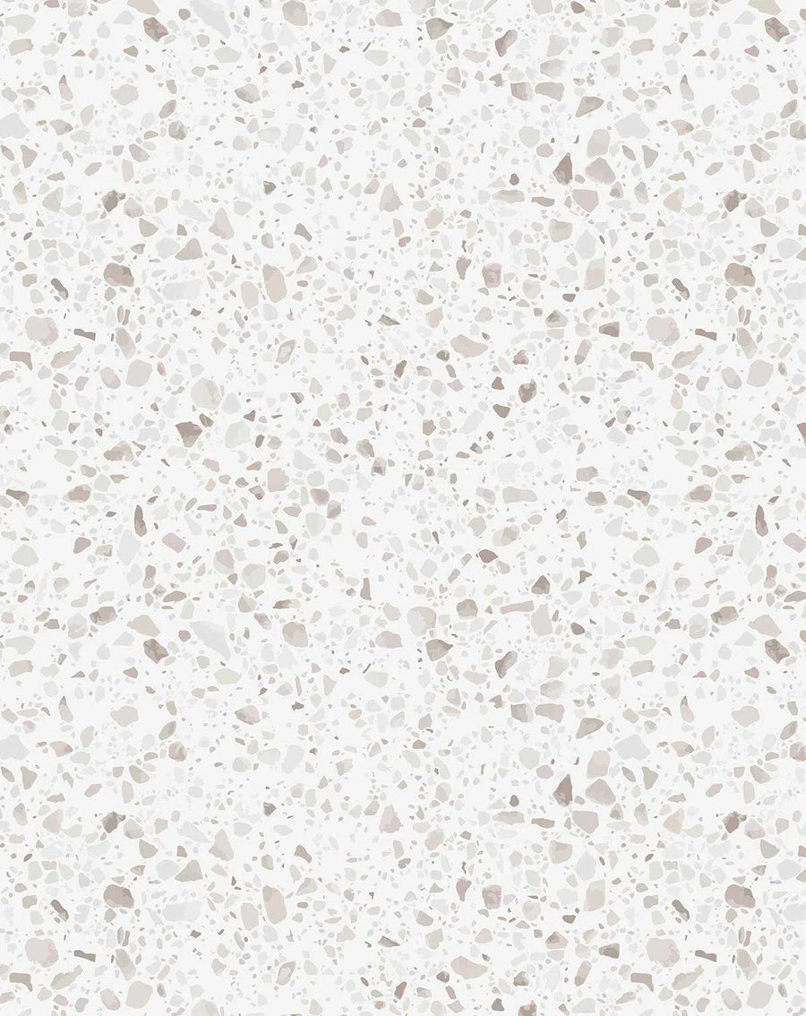 St Germain Terrazzo Wallpaper featuring a seamless pattern of scattered aggregate stone chips in varying shades of warm beige, taupe, grey, and cream against a soft white background, mimicking polished terrazzo flooring with a smooth, contemporary finish.