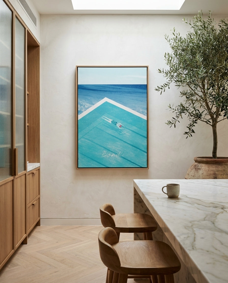 Bondi by Henry Rivers Sydney Bondi canvas wall art in a solid timber canvas float frame with oak finish styled in a coastal Australian home at Olive et Oriel