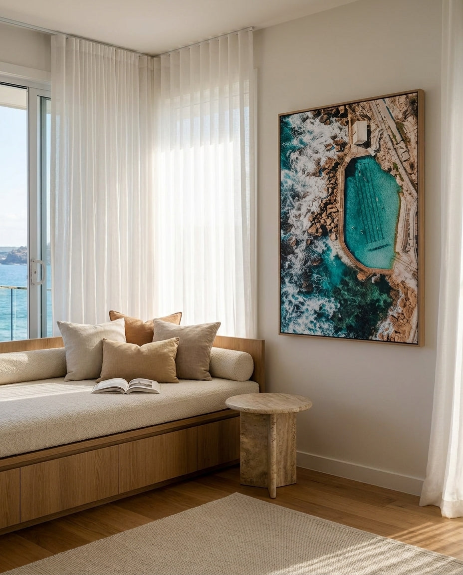 Bronte Pool From the Skies Sydney Bronte canvas wall art in a solid timber canvas float frame with oak finish styled in a coastal Australian home at Olive et Oriel
