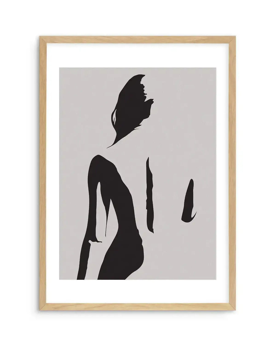 Abstract art print featuring a minimalist silhouette of a female body in black against a light grey background, with natural wood frame and white border. The figure is depicted from the back, with flowing lines suggesting movement and form.
