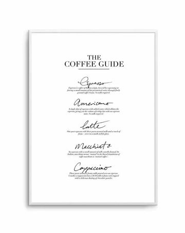 Framed art print with white border displaying "The Coffee Guide" as the title in serif typography at the top. Below are five coffee drink definitions written in elegant script handwriting: Espresso, Americano, Latte, Macchiato, and Cappuccino. Each drink name is followed by a small italicized description of its preparation method and ingredients. The entire design is printed in black text on a white background. The print is mounted in a light gray or silver-toned frame.