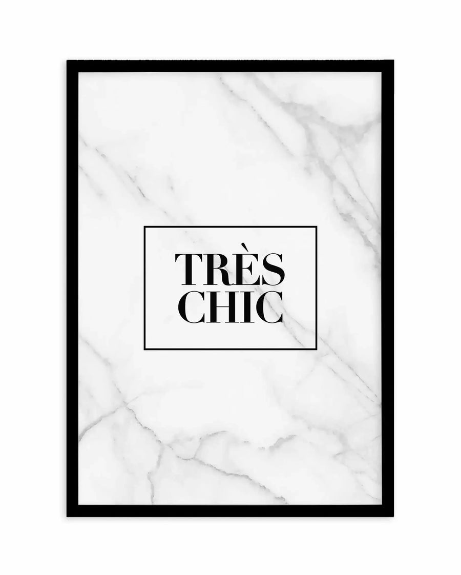 Framed art print with black border featuring white marble texture background with gray veining. Center rectangle contains black serif text reading "TRÈS CHIC" in elegant typography. White border surrounds the inner frame. Minimalist, sophisticated design on light marble aesthetic.