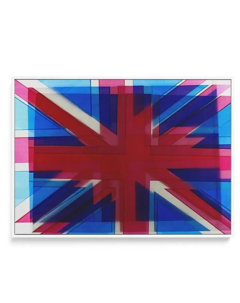 Union Jack Abstract framed canvas art print featuring a layered, geometric interpretation of the British flag. The design uses vibrant royal blue, deep navy, bright red, magenta pink, and cream white in overlapping rectangular blocks and diagonal stripes that create a modern, pixelated effect. Multiple translucent layers give the composition depth and movement. The canvas is mounted in a thin gray frame with a white border.