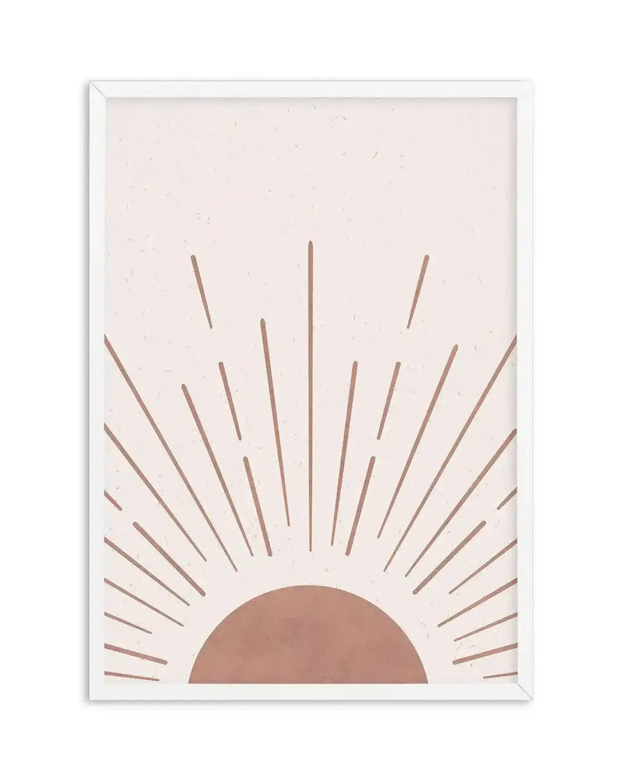 Art print featuring a minimalist illustration of a rising sun with a semi-circle in a warm terracotta hue at the bottom, emitting straight, dashed rays of the same colour against a textured, speckled pale pink background, displayed in a white frame with a white border.