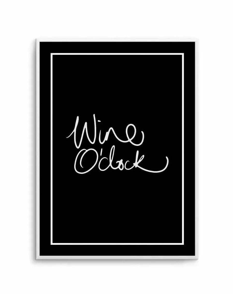 Art print featuring handwritten script text reading "Wine O'clock" in white cursive lettering centered on a solid black background, framed in white with a thin white border, mounted in a light gray frame.