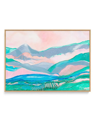 Canvas art print featuring an abstract landscape with rolling hills and mountains in layers of soft pink, teal, blue, and grey, with visible brushstrokes and paint drips, displayed in a natural oak frame.